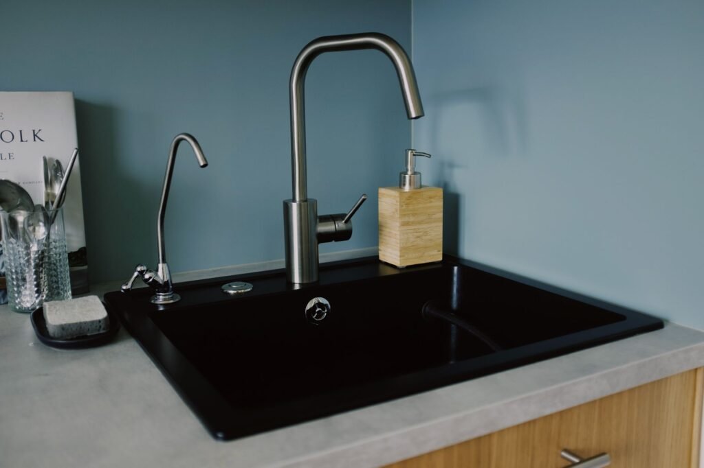 Kitchen sink and faucet in a minimal kitchen