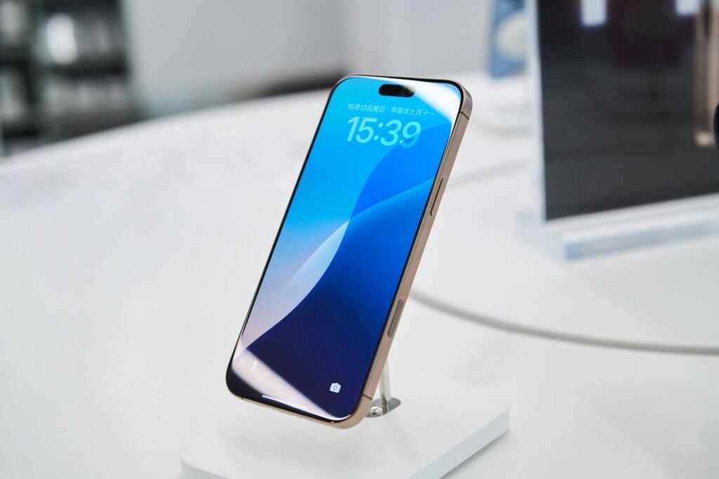 A smartphone on a display stand in a technology store