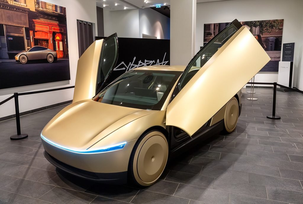 Tesla Cybercab two-seat robotaxi on display, the vehicle at the center of the Cybercab vs Uber comparison in Austin