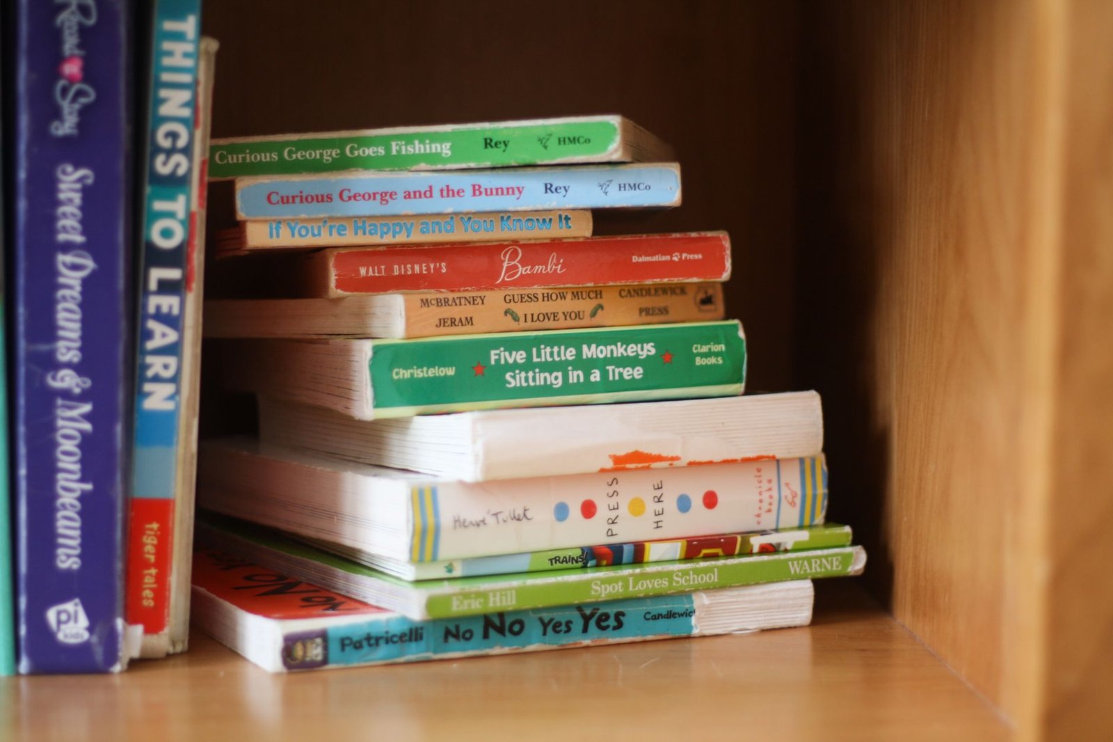 Colorful children's picture books on a shelf, of the kind on the Imagination Library book list